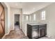 Upstairs hallway with adjacent cabinets and natural lighting from multiple windows at 7761 Sagamore Bay Ct, Las Vegas, NV 89179