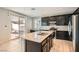 Modern kitchen featuring a center island and stainless steel appliances at 7761 Sagamore Bay Ct, Las Vegas, NV 89179