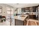 Gourmet kitchen with granite countertops, stainless steel appliances, and easy access to the backyard at 7761 Sagamore Bay Ct, Las Vegas, NV 89179