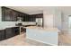 Bright kitchen with stainless steel appliances and a spacious center island at 7761 Sagamore Bay Ct, Las Vegas, NV 89179