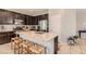 Well-equipped kitchen with granite countertops, a center island, and stainless steel appliances at 7761 Sagamore Bay Ct, Las Vegas, NV 89179