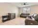 Inviting living room area featuring tiled floors and neutral color scheme at 7761 Sagamore Bay Ct, Las Vegas, NV 89179