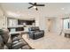 Spacious living room with tile floors and open concept to the kitchen at 7761 Sagamore Bay Ct, Las Vegas, NV 89179