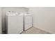 Bright laundry room with a white washer and dryer set at 7777 Vino Vranec Ct, Las Vegas, NV 89113