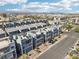 Aerial view of modern townhomes with roof decks in a well-maintained community, close to the city at 8042 Misty Canyon Ave, Las Vegas, NV 89113
