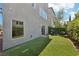 The backyard features a well maintained lawn with a grill, perfect for entertainment and enjoying the outdoors at 8042 Misty Canyon Ave, Las Vegas, NV 89113