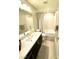 Well-lit bathroom featuring a large mirror, modern vanity, and shower-tub combination at 8042 Misty Canyon Ave, Las Vegas, NV 89113