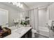 Bathroom featuring modern vanity, neutral color palette, and shower-tub combination at 8042 Misty Canyon Ave, Las Vegas, NV 89113