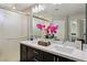 Bathroom featuring double vanity, large mirror, and frosted glass shower at 8042 Misty Canyon Ave, Las Vegas, NV 89113