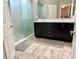 Modern bathroom with double vanity, sleek fixtures, and a glass-enclosed shower for a spa-like experience at 8042 Misty Canyon Ave, Las Vegas, NV 89113