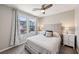 Bright bedroom with a comfortable bed, side tables, and natural light from the window at 8042 Misty Canyon Ave, Las Vegas, NV 89113
