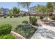 Scenic view of a community park with lush greenery, walking paths, and landscaping at 8042 Misty Canyon Ave, Las Vegas, NV 89113