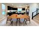 Bright, open-concept dining area featuring modern furnishings and seamlessly connected to the kitchen and living spaces at 8042 Misty Canyon Ave, Las Vegas, NV 89113