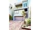 Modern two-story home with a purple door and brick driveway at 8042 Misty Canyon Ave, Las Vegas, NV 89113