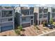 Contemporary home showcasing multi-level balconies, modern design, and a front driveway with parking at 8042 Misty Canyon Ave, Las Vegas, NV 89113