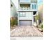 Modern home featuring a two-car garage, balcony and low maintenance landscaping at 8042 Misty Canyon Ave, Las Vegas, NV 89113