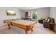 Spacious game room features a pool table, TV, and comfortable seating for relaxation and entertainment at 8042 Misty Canyon Ave, Las Vegas, NV 89113