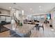 Open-concept living space includes a kitchen with a large island and a spacious dining and living area at 8042 Misty Canyon Ave, Las Vegas, NV 89113