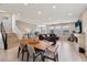 Spacious open-concept living area with modern furnishings, hardwood floors, and bright natural light at 8042 Misty Canyon Ave, Las Vegas, NV 89113