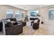 Bright open-concept living space featuring cozy seating area with electric fireplace and media center at 8042 Misty Canyon Ave, Las Vegas, NV 89113