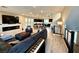 Open floor plan showcasing the living room with modern decor, fireplace, and seamless flow to the kitchen at 8042 Misty Canyon Ave, Las Vegas, NV 89113