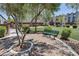 Relaxing park seating area with benches, pavers, mature trees and landscaping at 8042 Misty Canyon Ave, Las Vegas, NV 89113