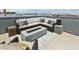 Stylish rooftop deck with cozy seating and a modern fire pit, perfect for entertaining and relaxation at 8042 Misty Canyon Ave, Las Vegas, NV 89113