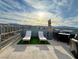 Expansive rooftop patio with lounge chairs, dining area, and panoramic views, perfect for outdoor living and entertaining at 8042 Misty Canyon Ave, Las Vegas, NV 89113