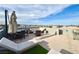Rooftop deck featuring an outdoor grill, dining area, lounge seating, and expansive views at 8042 Misty Canyon Ave, Las Vegas, NV 89113