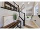Modern staircase with black railing and natural lighting at 8042 Misty Canyon Ave, Las Vegas, NV 89113