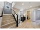 Open staircase leading to the upper level with modern railing and bright lighting at 8042 Misty Canyon Ave, Las Vegas, NV 89113