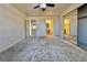 Large bedroom with soft carpet, ceiling fan and mirror closet doors at 8410 Eldora Ave # 2046, Las Vegas, NV 89117