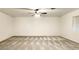 Vast bedroom featuring a ceiling fan, neutral carpet, and natural light from a side window at 8410 Eldora Ave # 2046, Las Vegas, NV 89117