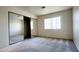 The bedroom features sliding mirror closet doors, a window, and soft carpeted floors at 8410 Eldora Ave # 2046, Las Vegas, NV 89117