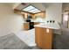 Kitchen with tile floors, light countertops and light wood cabinets at 8410 Eldora Ave # 2046, Las Vegas, NV 89117