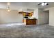 Spacious living room with new carpeting and access to kitchen at 8410 Eldora Ave # 2046, Las Vegas, NV 89117