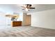 Open-concept living space with an adjacent kitchen featuring a breakfast bar and appliances at 8410 Eldora Ave # 2046, Las Vegas, NV 89117