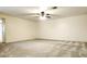 Expansive living room area with a ceiling fan and neutral carpet throughout the residence at 8410 Eldora Ave # 2046, Las Vegas, NV 89117