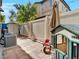 This view of the backyard features a charming playhouse and convenient storage shed along a fenced perimeter at 8754 Brindisi Park Ave, Las Vegas, NV 89148