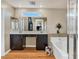 Beautiful bathroom featuring a double vanity, soaking tub and glass enclosed shower at 8754 Brindisi Park Ave, Las Vegas, NV 89148