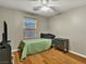 Bedroom with hardwood flooring, natural light, and minimalist decor at 8754 Brindisi Park Ave, Las Vegas, NV 89148