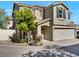 Two-story home featuring desert-friendly landscaping at 8754 Brindisi Park Ave, Las Vegas, NV 89148