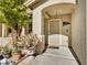 Inviting front porch featuring desert landscaping, a neutral color palette and a secured entrance at 8754 Brindisi Park Ave, Las Vegas, NV 89148