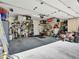 A spacious, organized garage featuring ample storage with shelving and overhead storage racks and lighting at 8754 Brindisi Park Ave, Las Vegas, NV 89148