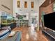 Open-concept living room featuring a large, comfortable leather sofa and an impressive fish tank at 8754 Brindisi Park Ave, Las Vegas, NV 89148