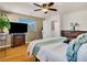 The main bedroom offers hardwood floors, ceiling fan, and a spacious layout at 8754 Brindisi Park Ave, Las Vegas, NV 89148