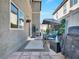 Charming patio area with a swing, BBQ, and outdoor seating, ideal for relaxing or entertaining guests at 8754 Brindisi Park Ave, Las Vegas, NV 89148