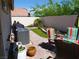 Spacious backyard featuring a patio, grill, manicured lawn, and privacy wall at 9705 Templemore Ave # 102, Las Vegas, NV 89129