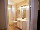 Bright bathroom with a shower-tub combination and a white vanity at 9705 Templemore Ave # 102, Las Vegas, NV 89129