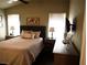 Comfortable bedroom featuring neutral tones, a ceiling fan, and natural light at 9705 Templemore Ave # 102, Las Vegas, NV 89129